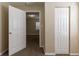View of a neutral bedroom with carpet from the doorway and a closet at 2634 E 38Th Ave, Tampa, FL 33610