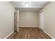 Empty room with wood-look flooring and white trim at 2634 E 38Th Ave, Tampa, FL 33610