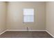 Neutral bedroom featuring a large window, neutral walls, and neutral floors at 2634 E 38Th Ave, Tampa, FL 33610