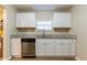 Well-appointed kitchen featuring stainless steel appliances and white cabinetry at 2634 E 38Th Ave, Tampa, FL 33610