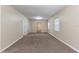 Spacious living room featuring neutral walls and floors, and large windows for natural light at 2634 E 38Th Ave, Tampa, FL 33610