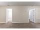 Spacious living room featuring neutral colors, neutral floors, and two entryways at 2634 E 38Th Ave, Tampa, FL 33610