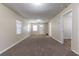 Bright living room with neutral walls, a large front window and neutral floors at 2634 E 38Th Ave, Tampa, FL 33610