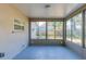 This sun room is encased with large windows and screens for ventilation and overlooks the fenced backyard at 2634 E 38Th Ave, Tampa, FL 33610
