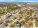 A wide aerial view captures a city, showcasing various buildings and tree-lined streets at 6731 Ranger Dr, Tampa, FL 33615