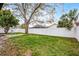 Lush backyard with a pristine white fence providing privacy at 6731 Ranger Dr, Tampa, FL 33615