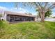 Spacious backyard with a screened lanai perfect for outdoor living at 6731 Ranger Dr, Tampa, FL 33615