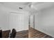 Bedroom featuring ceiling fan, and closet with wood-look flooring at 6731 Ranger Dr, Tampa, FL 33615