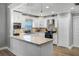 Stylish kitchen with white cabinetry, granite countertops, stainless steel appliances, and a functional design at 6731 Ranger Dr, Tampa, FL 33615
