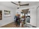 Office featuring ceiling fan, workstation, and sliding glass doors to the outside at 6731 Ranger Dr, Tampa, FL 33615
