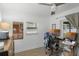 Bright office space features wood-look floors, a ceiling fan, and a large window for natural light at 6731 Ranger Dr, Tampa, FL 33615