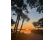 Idyllic sunset view of a water view with palm trees at 7525 Sundial Ter, Sarasota, FL 34231