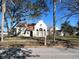 Charming home with a unique architectural style, featuring a tile roof and arched windows at 1827 2Nd E Ave, Bradenton, FL 34208