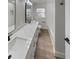 A modern bathroom featuring double sinks and quartz countertops at 2642 49Th N St, St Petersburg, FL 33710
