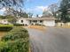 Charming home with a well-maintained yard, driveway, and attached garage at 2642 49Th N St, St Petersburg, FL 33710