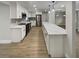 Spacious kitchen featuring quartz countertops, stainless steel appliances, and contemporary lighting at 2642 49Th N St, St Petersburg, FL 33710