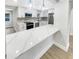 Bright kitchen features stainless steel appliances, undermount sink and quartz counters at 2642 49Th N St, St Petersburg, FL 33710