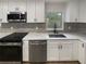 Modern kitchen with stainless steel appliances and stylish countertops at 2642 49Th N St, St Petersburg, FL 33710