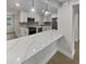 Modern kitchen features sleek white cabinets, stainless steel appliances, and quartz countertops at 2642 49Th N St, St Petersburg, FL 33710