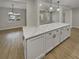 Kitchen view highlighting the center island with white cabinetry, quartz counters, and open concept layout at 2642 49Th N St, St Petersburg, FL 33710