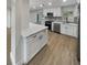 Renovated kitchen with stainless steel appliances, quartz countertops, and new white cabinetry at 2642 49Th N St, St Petersburg, FL 33710