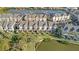 Aerial view of the neighborhood showcasing waterfront homes with a canal at 4324 Spinnaker Cove Ln, Tampa, FL 33615