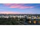 Scenic aerial view of waterfront community homes with lush landscaping and serene pond at 4324 Spinnaker Cove Ln, Tampa, FL 33615