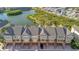Aerial view of townhomes highlighting their architectural style, landscaping, and proximity to the lake at 4324 Spinnaker Cove Ln, Tampa, FL 33615