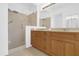 Spacious bathroom featuring a walk-in shower and double vanity at 4324 Spinnaker Cove Ln, Tampa, FL 33615