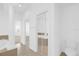 Bright bathroom featuring a toilet, glass-enclosed shower, and closet space at 4324 Spinnaker Cove Ln, Tampa, FL 33615