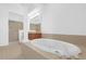Bright bathroom with a soaking tub and a glass shower door at 4324 Spinnaker Cove Ln, Tampa, FL 33615
