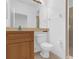 Bathroom featuring a modern vanity, toilet, and tiled shower at 4324 Spinnaker Cove Ln, Tampa, FL 33615