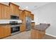 Kitchen showcases stainless steel appliances, granite countertops, and light wood cabinets at 4324 Spinnaker Cove Ln, Tampa, FL 33615