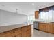 Open kitchen with granite countertops and stainless steel dishwasher at 4324 Spinnaker Cove Ln, Tampa, FL 33615