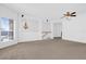 Spacious living room with ceiling fan and staircase at 4324 Spinnaker Cove Ln, Tampa, FL 33615