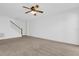 Living room with neutral carpet, white walls and a ceiling fan at 4324 Spinnaker Cove Ln, Tampa, FL 33615