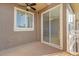 Balcony featuring a sliding glass door, and neutral stucco at 4324 Spinnaker Cove Ln, Tampa, FL 33615