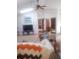 Inviting living room with high ceilings, ceiling fan, and a cozy seating area, perfect for relaxation and entertainment at 4375 Neff Lake Road, Brooksville, FL 34601