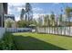 Lush backyard with manicured lawn, lounge chairs, and bamboo providing privacy to the modern home at 1056 Snell Isle Ne Blvd, St Petersburg, FL 33704