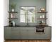Charming bar area with a view of the exterior, floating shelves, and sleek countertops at 1056 Snell Isle Ne Blvd, St Petersburg, FL 33704