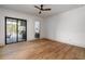 Bedroom with hardwood floors and access to patio with outdoor grill at 1056 Snell Isle Ne Blvd, St Petersburg, FL 33704