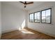 Bedroom with hardwood floors and large windows overlooking a green landscape at 1056 Snell Isle Ne Blvd, St Petersburg, FL 33704