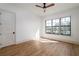 Bedroom featuring hardwood floors and large windows overlooking a green landscape at 1056 Snell Isle Ne Blvd, St Petersburg, FL 33704