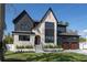 Grand two-story home with stone and dark siding, manicured lawn, and an inviting entryway at 1056 Snell Isle Ne Blvd, St Petersburg, FL 33704