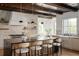 Bright kitchen showcases a large island with seating, stone backsplash, and breakfast nook at 1056 Snell Isle Ne Blvd, St Petersburg, FL 33704