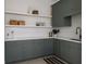Stylish kitchenette with custom cabinets, open shelves, modern appliances, and a sleek design for functionality at 1056 Snell Isle Ne Blvd, St Petersburg, FL 33704