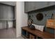 Well-organized mudroom with a built-in bench, coat hooks, storage cabinets, and convenient access to the home at 1056 Snell Isle Ne Blvd, St Petersburg, FL 33704