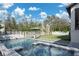 Inviting backyard pool and spa area with an umbrella and lounge chairs for relaxation at 1056 Snell Isle Ne Blvd, St Petersburg, FL 33704