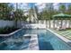 Beautiful backyard pool with stepping stones and landscaping with bamboo accents at 1056 Snell Isle Ne Blvd, St Petersburg, FL 33704