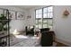 Cozy sitting area with large windows, comfortable chairs, and natural light for relaxation and enjoyment at 1056 Snell Isle Ne Blvd, St Petersburg, FL 33704
